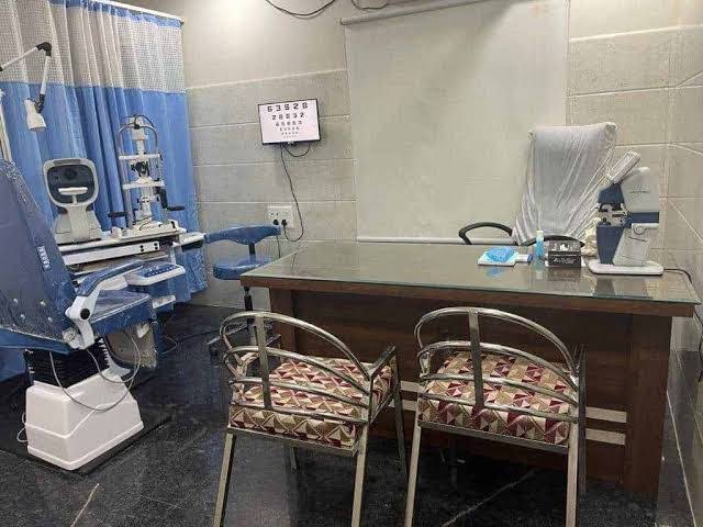 Hospital eye consultation room with vision chart and examination equipment